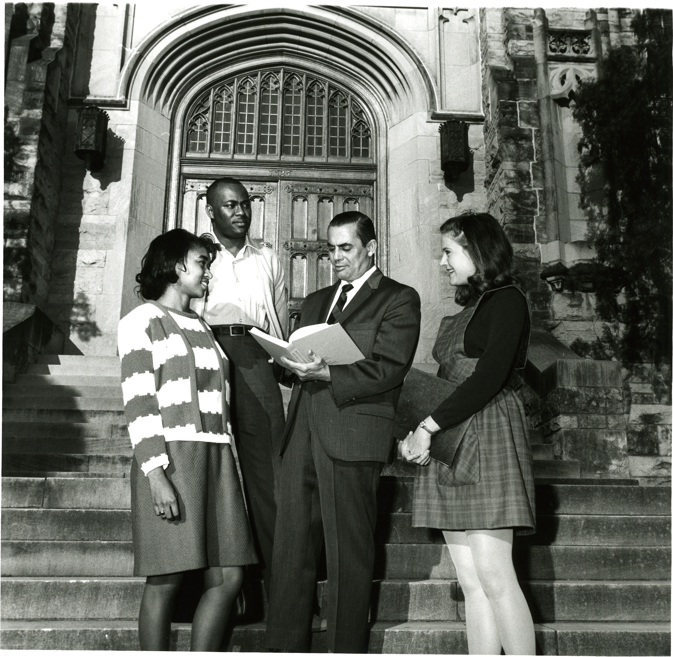 Students and faculty in front of old library